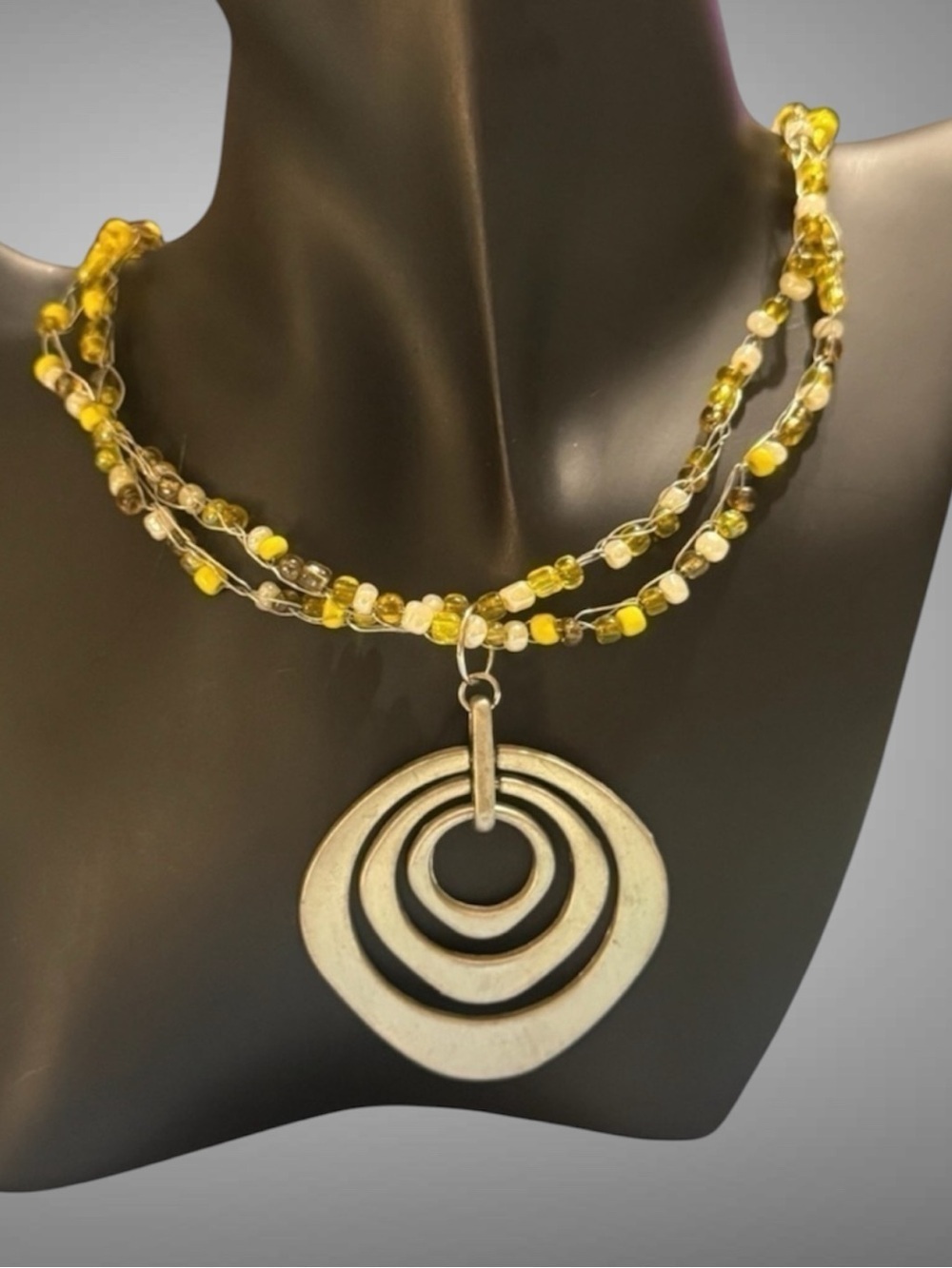 BEADED YELLOW AND SILVER MEDALLION NECKLACE